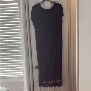 Elegant Black Dress with Embroidered Hem
